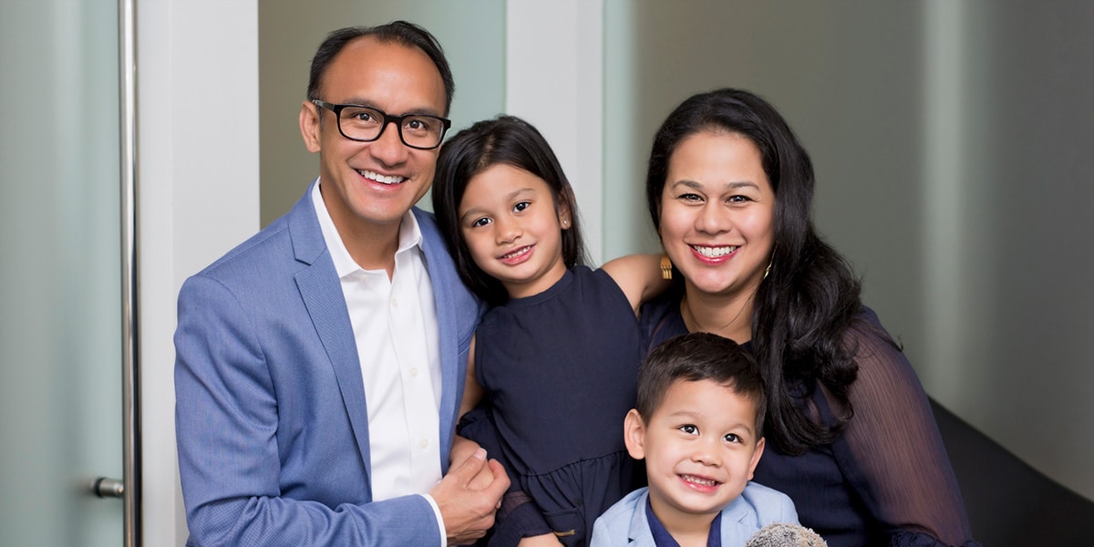 Dr. Paguio and his family at the dental office.