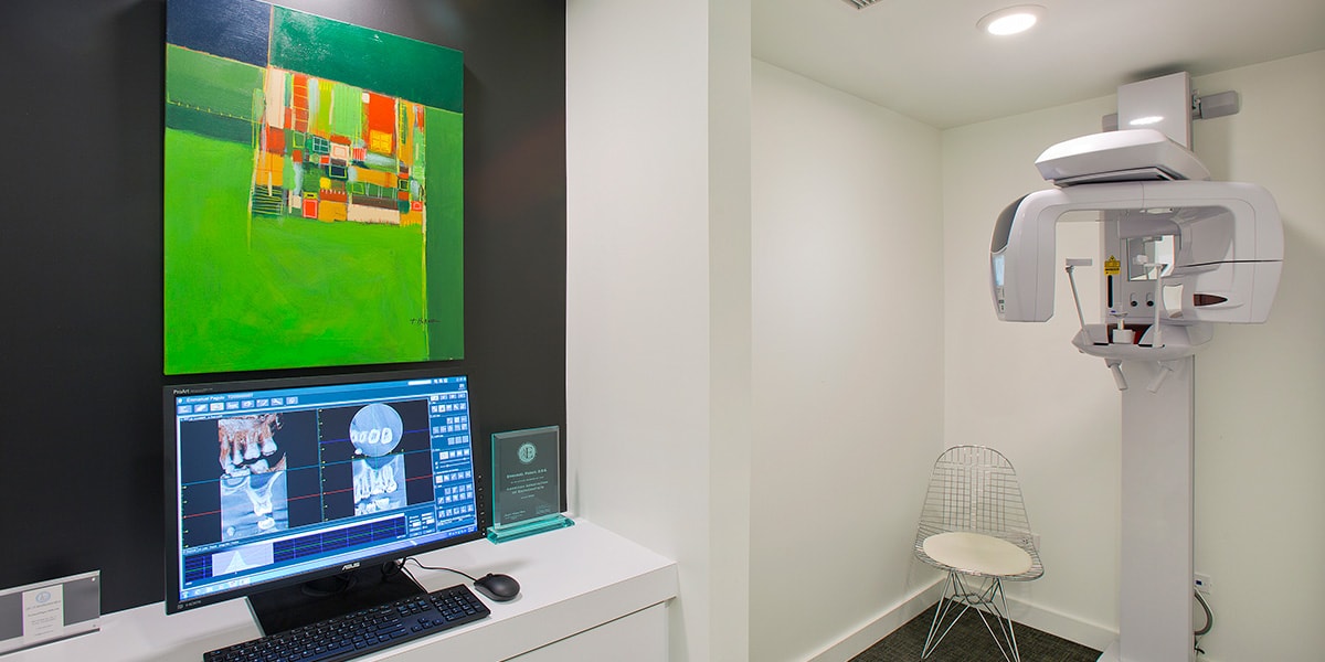 Dental imaging room with modern technology.